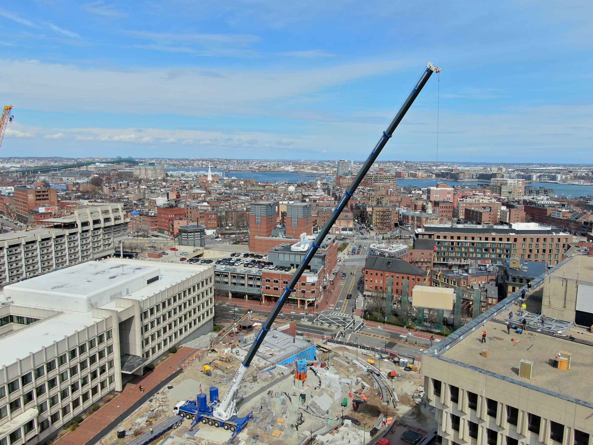 CJ Shaughnessy crane working over a downtown Boston job site